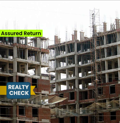 What is assured return scheme in real estate?